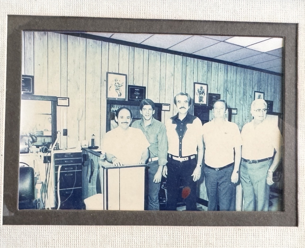 Framed archival photograph in a barbershop